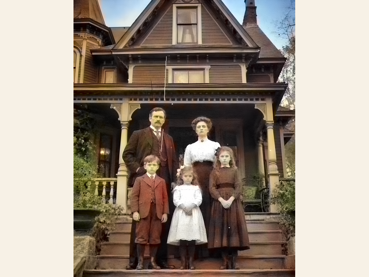The restored family photo in colour after 4x upscaling and colourisation, much clearer than the faded original.